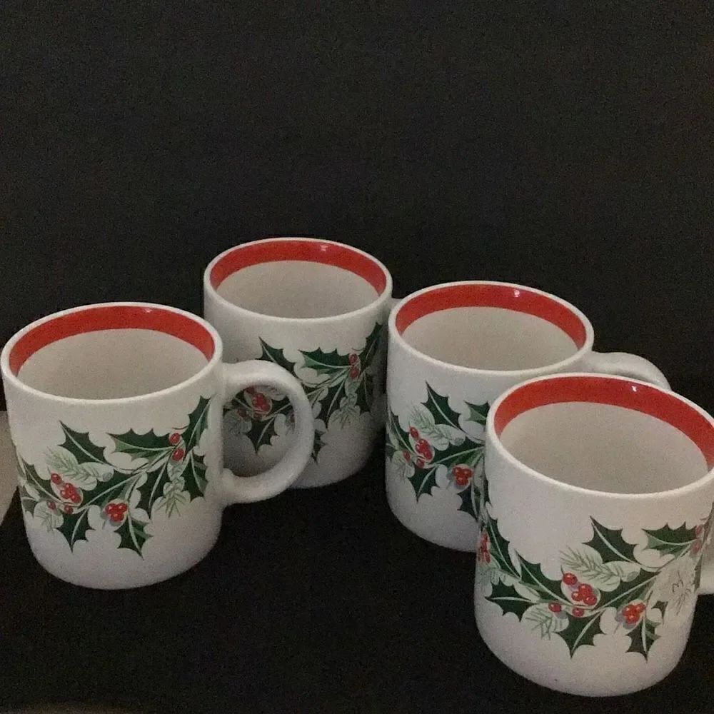 Set of four signed holiday coffee mugs